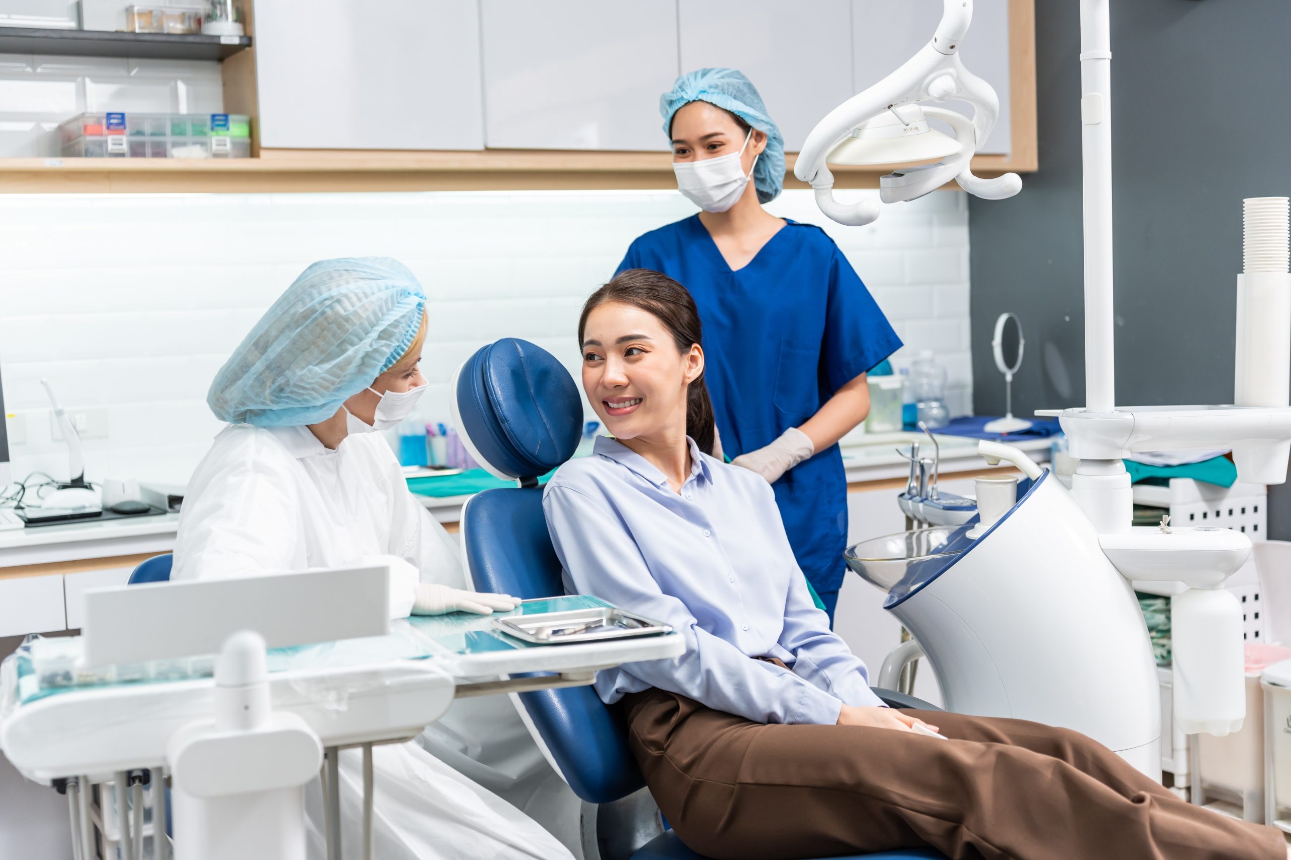 A professional reception area at Metro Dental office, showcasing a well-lit space with contemporary furniture and a welcoming ambiance.